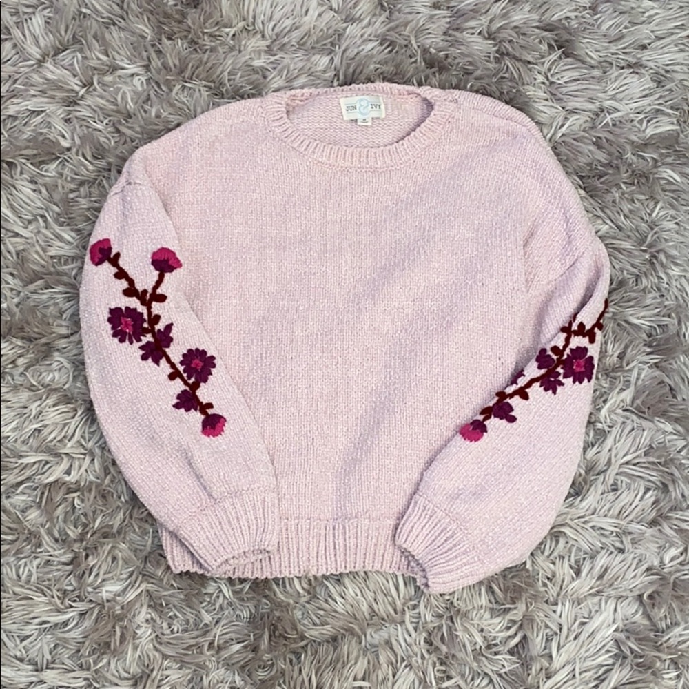 Pink sweater with flower detail on sleeves